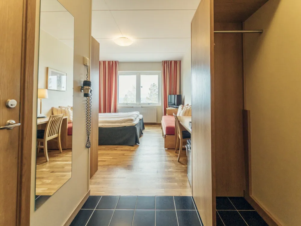 Dubbelrum med balkong och fjällutsikt på Pernilla Wiberg Hotel