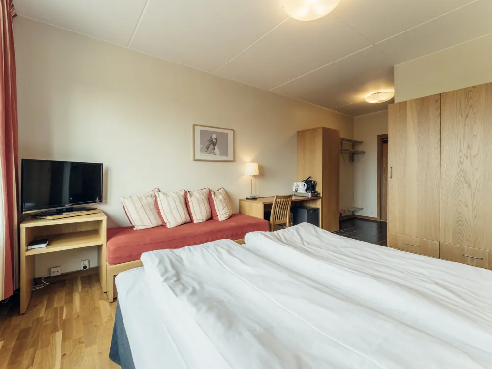 Dubbelrum med balkong och fjällutsikt på Pernilla Wiberg Hotel