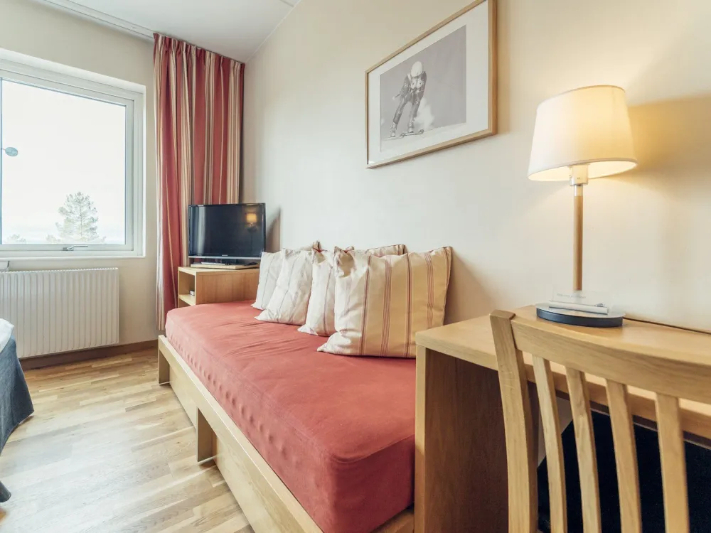 Dubbelrum med balkong och fjällutsikt på Pernilla Wiberg Hotel