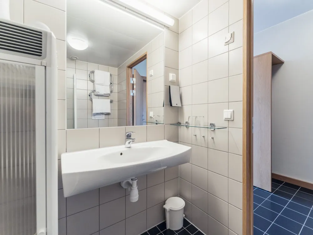 Dubbelrum med balkong och fjällutsikt på Pernilla Wiberg Hotel